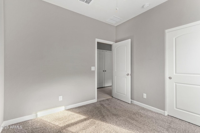 unfurnished bedroom with light colored carpet