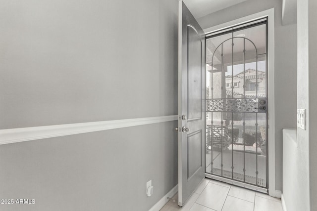 entryway featuring light tile patterned floors