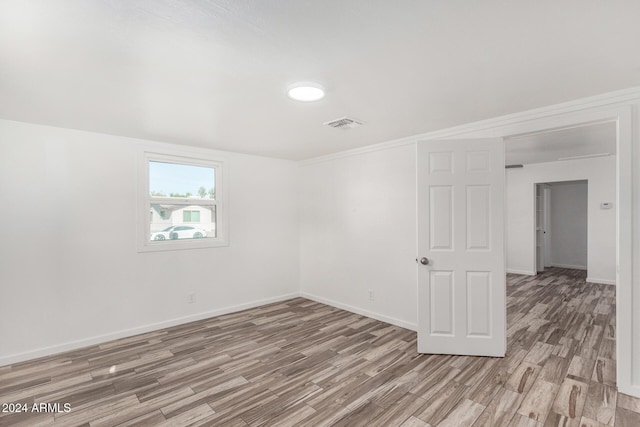 empty room with light hardwood / wood-style floors