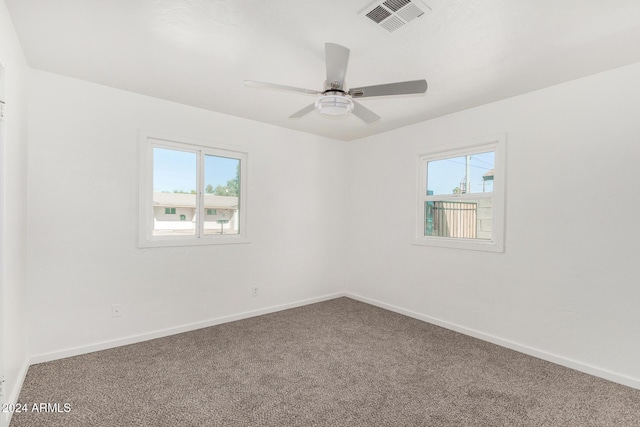 unfurnished room with ceiling fan and carpet floors