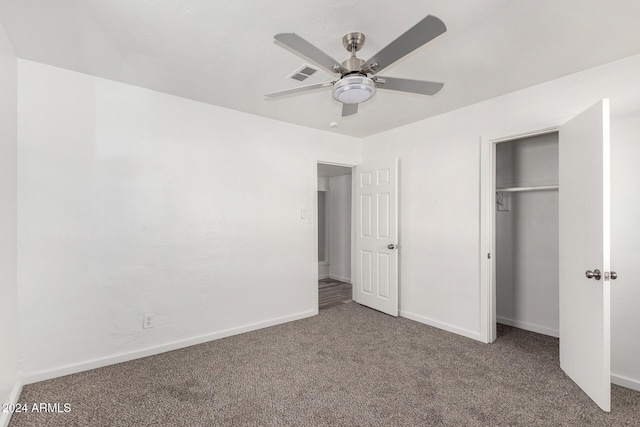 unfurnished bedroom featuring ceiling fan, a closet, and carpet