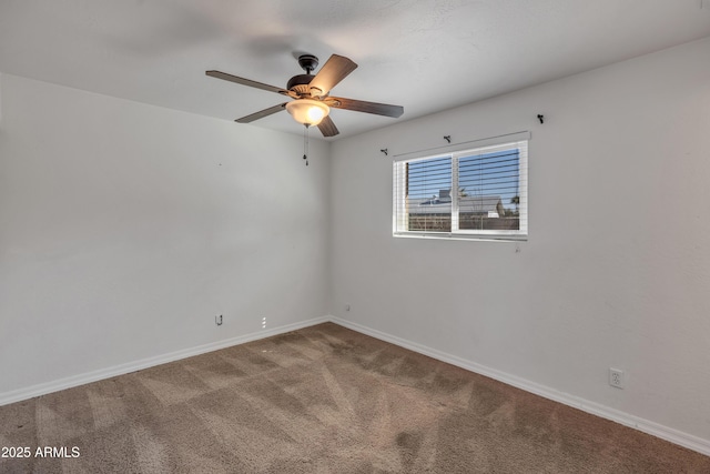 unfurnished room with carpet flooring and ceiling fan