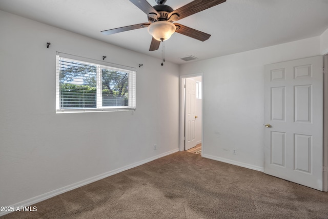 unfurnished bedroom with ceiling fan and carpet flooring