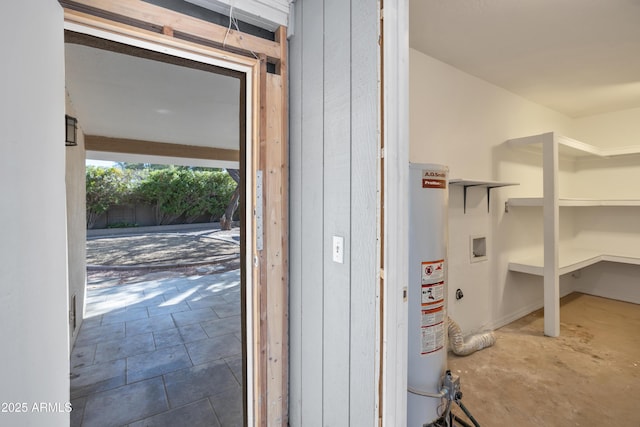 storage room featuring water heater