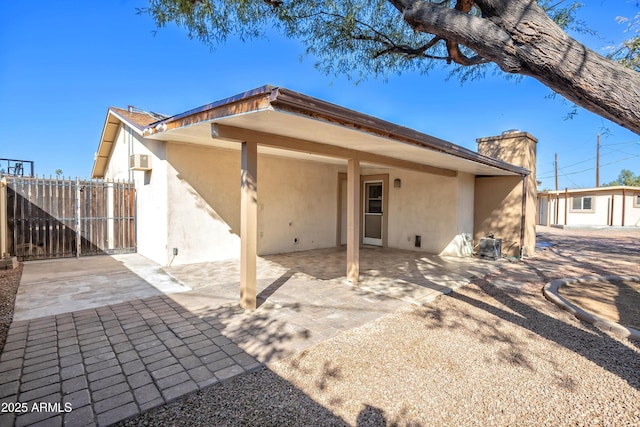 back of property with a patio area