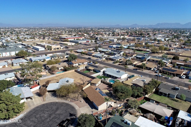 birds eye view of property with a mountain view