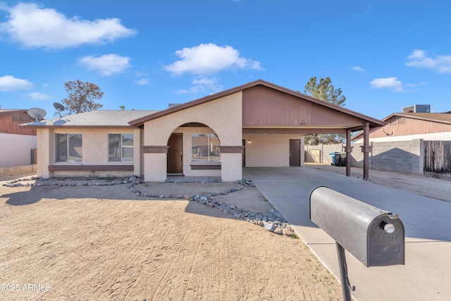 single story home featuring a carport