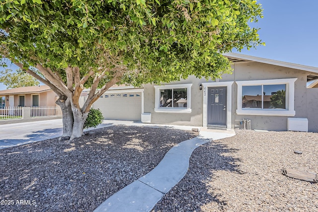 662 W Elena Ave, Mesa, AZ 85210 - obstructed view of property with stucco siding, driveway, and an attached garage