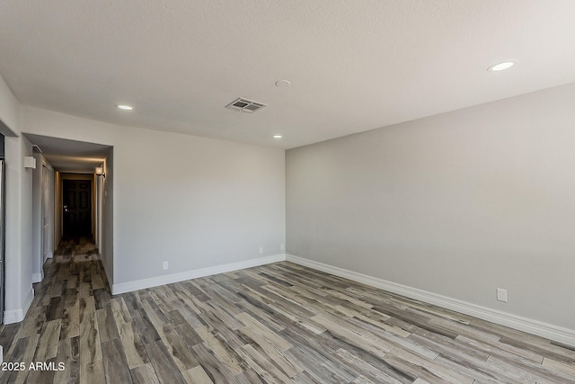 662 W Elena Ave, Mesa, AZ 85210 - empty room featuring wood finished floors, recessed lighting, and baseboards
