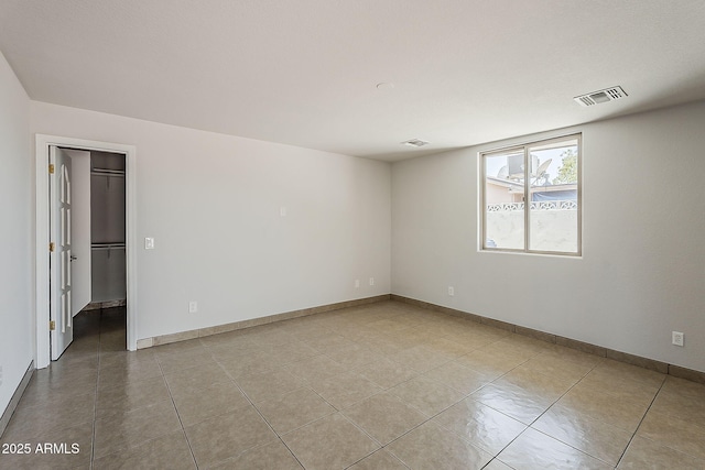 662 W Elena Ave, Mesa, AZ 85210 - spare room with tile patterned flooring and baseboards