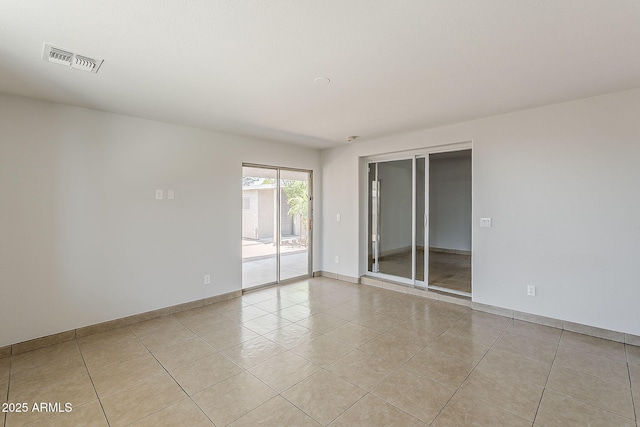662 W Elena Ave, Mesa, AZ 85210 - unfurnished room with light tile patterned floors and baseboards