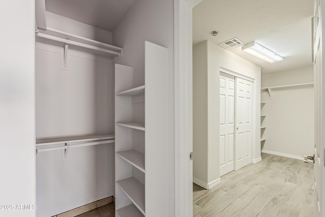662 W Elena Ave, Mesa, AZ 85210 - walk in closet with wood finished floors