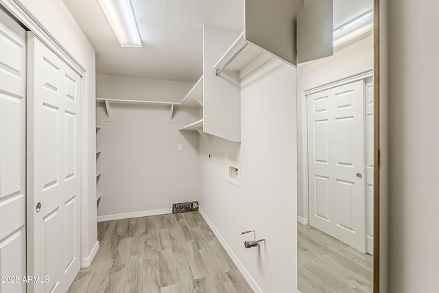 662 W Elena Ave, Mesa, AZ 85210 - washroom featuring hookup for a washing machine, light wood finished floors, and baseboards