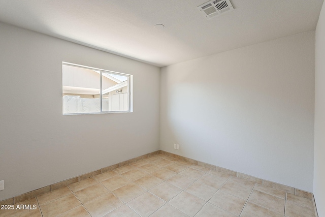 662 W Elena Ave, Mesa, AZ 85210 - empty room featuring light tile patterned flooring and baseboards
