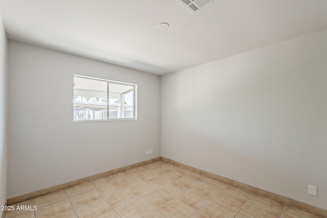 662 W Elena Ave, Mesa, AZ 85210 - empty room with light tile patterned floors and baseboards