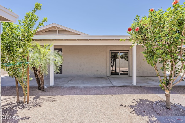 662 W Elena Ave, Mesa, AZ 85210 - doorway to property featuring stucco siding and a patio