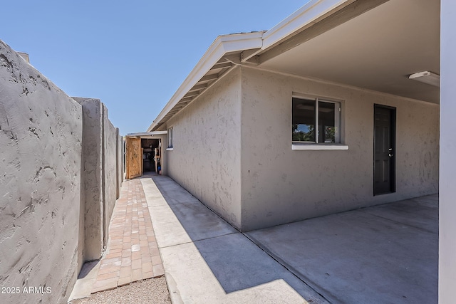 662 W Elena Ave, Mesa, AZ 85210 - view of property exterior featuring stucco siding and a patio