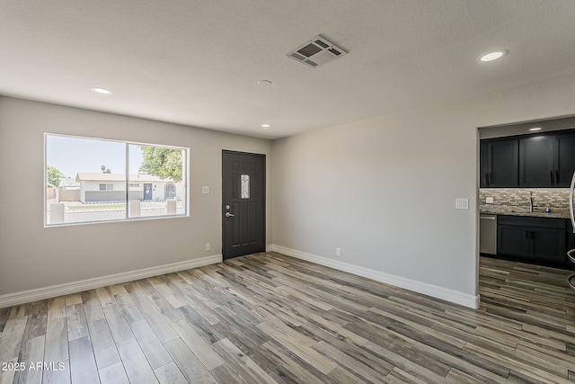 662 W Elena Ave, Mesa, AZ 85210 - entryway with wood finished floors, recessed lighting, and baseboards