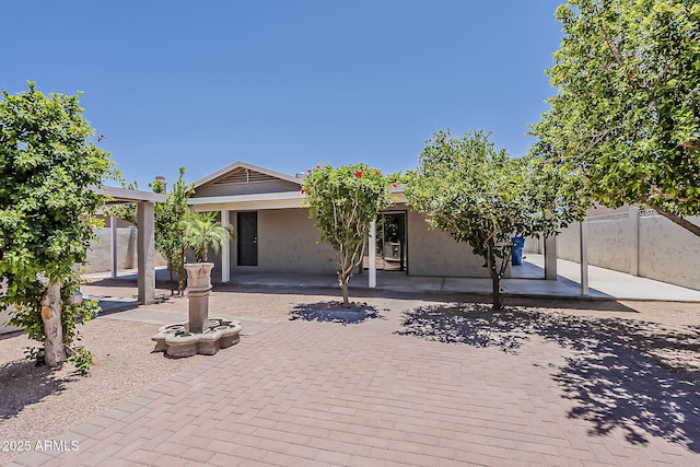 662 W Elena Ave, Mesa, AZ 85210 - view of front of property with stucco siding and a patio area