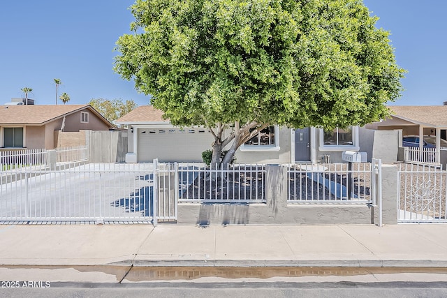 662 W Elena Ave, Mesa, AZ 85210 - view of front of property with a fenced front yard, stucco siding, and an attached garage