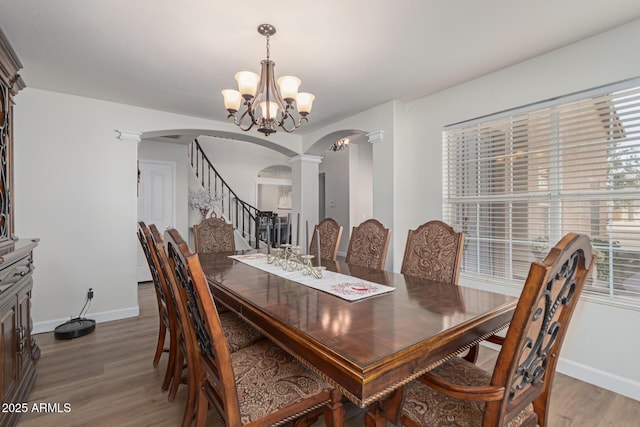 dining area with a chandelier and hardwood / wood-style floors