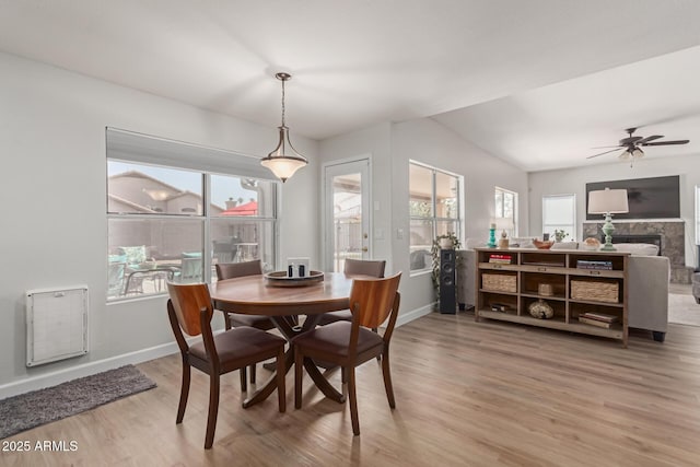 dining area with hardwood / wood-style flooring, plenty of natural light, and ceiling fan