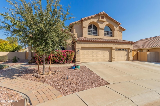 mediterranean / spanish-style home with a garage