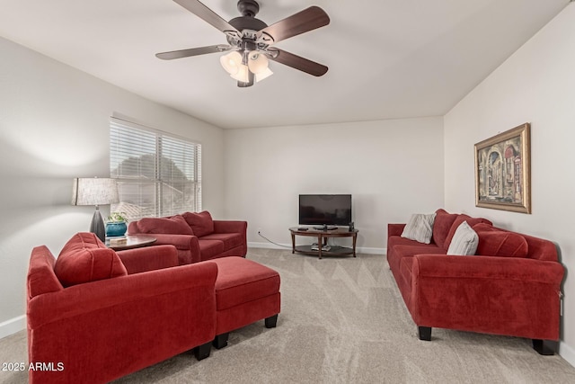 carpeted living room featuring ceiling fan