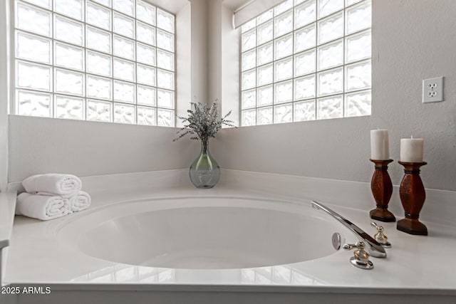 bathroom with a washtub