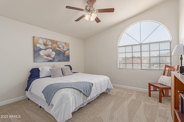 bedroom featuring vaulted ceiling, light carpet, and ceiling fan