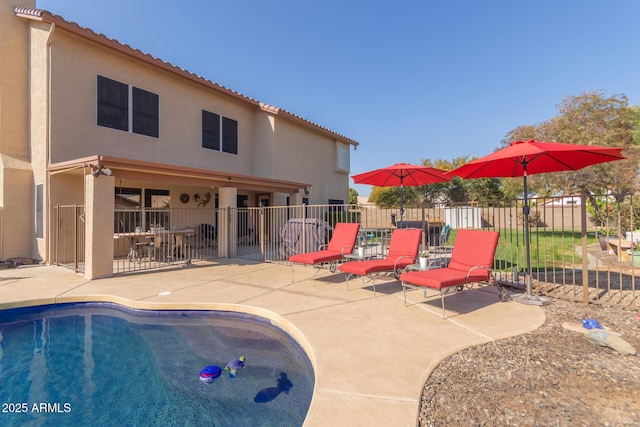 view of swimming pool featuring a patio