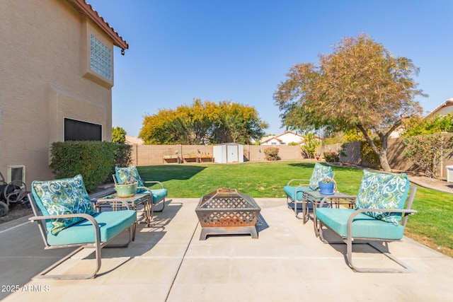 view of patio featuring a storage unit and an outdoor fire pit