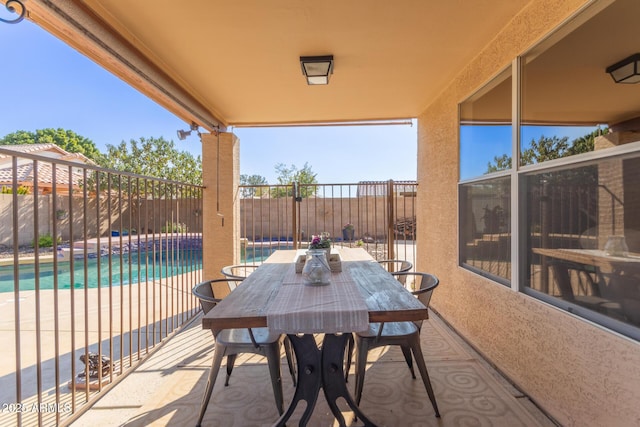 view of patio featuring a fenced in pool