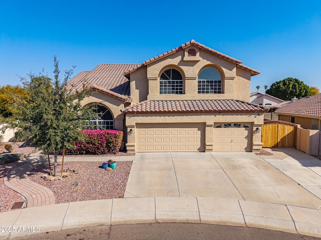 mediterranean / spanish-style home featuring a garage