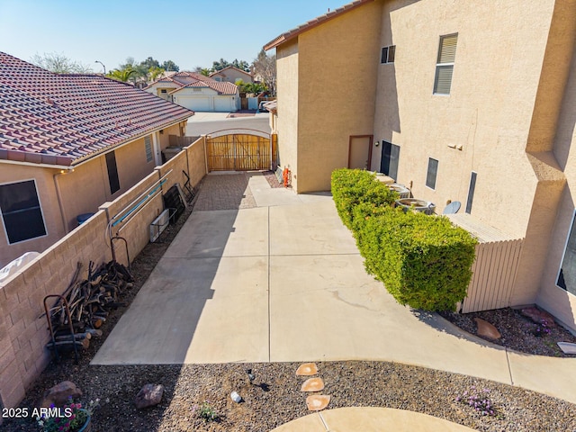 view of side of home featuring a patio