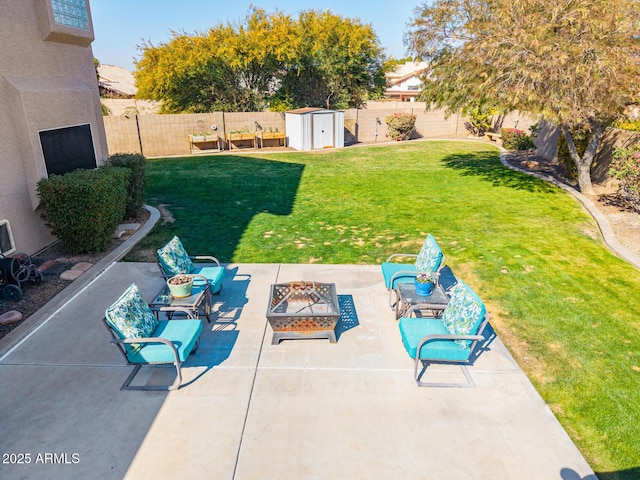 view of patio with an outdoor fire pit and a shed