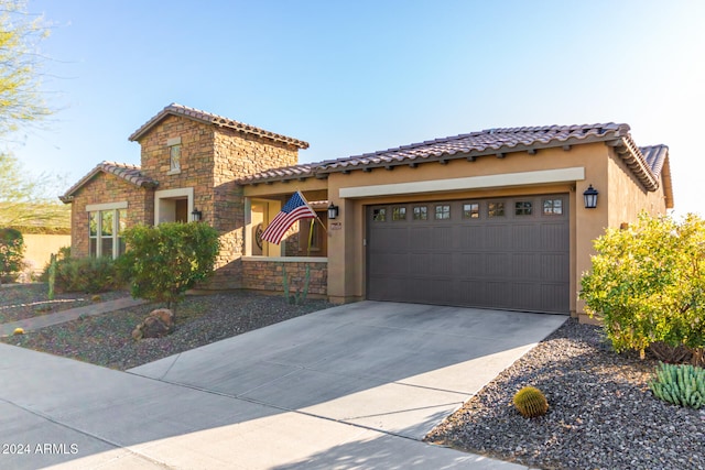 mediterranean / spanish house featuring a garage