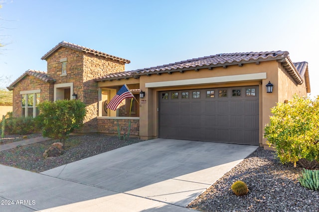 mediterranean / spanish house with a garage