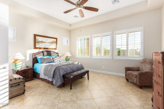 tiled bedroom with ceiling fan