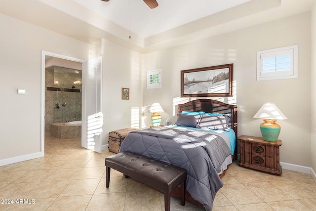 tiled bedroom featuring ensuite bath and ceiling fan