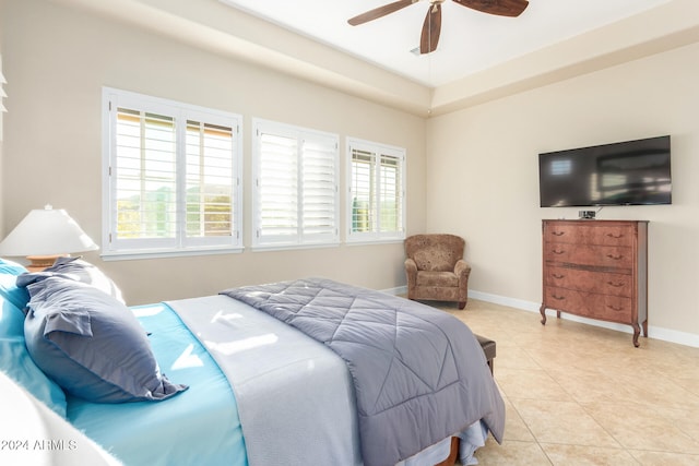 tiled bedroom with ceiling fan