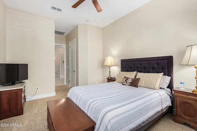 bedroom with ceiling fan and light colored carpet