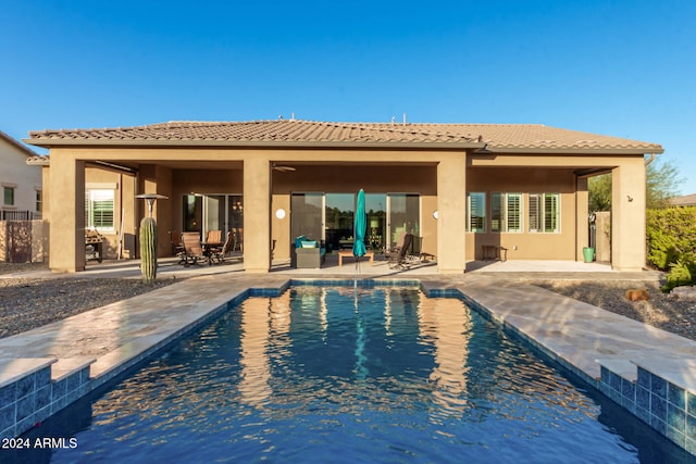 rear view of property with a patio area