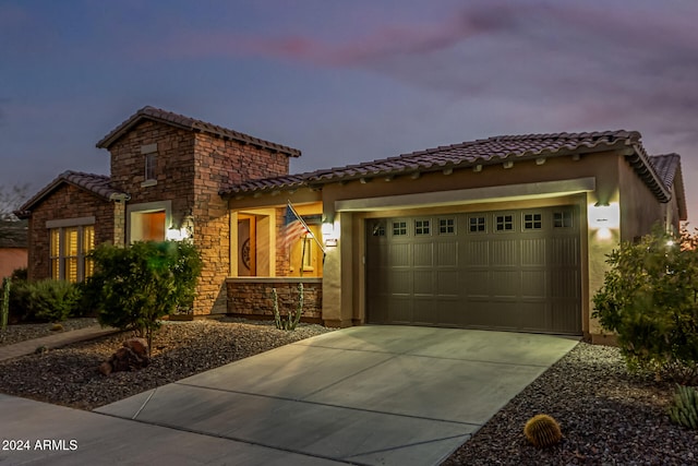 view of front of property featuring a garage