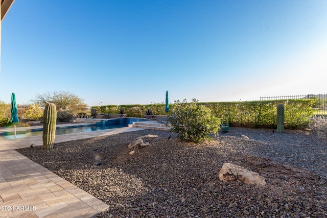 view of yard featuring a fenced in pool