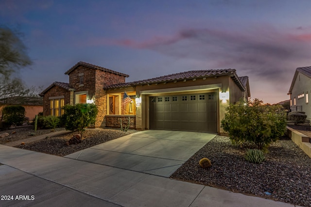 mediterranean / spanish house featuring a garage