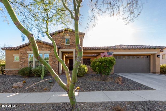 view of front of property with a garage