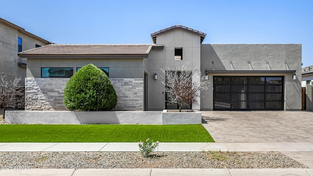 3822 E Canyon Pl, Chandler, AZ 85249 - contemporary house with decorative driveway, stucco siding, a garage, a front lawn, and a tiled roof