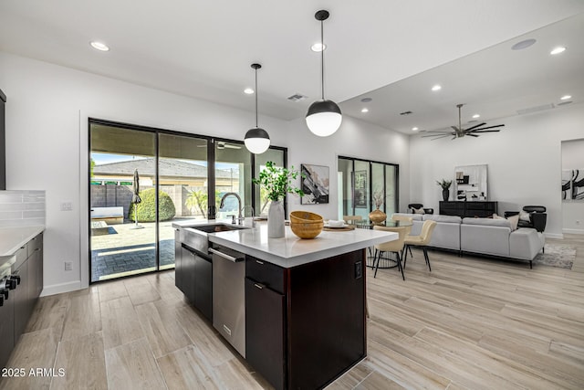 3822 E Canyon Pl, Chandler, AZ 85249 - kitchen with dishwasher, light countertops, recessed lighting, light wood-style flooring, and ceiling fan