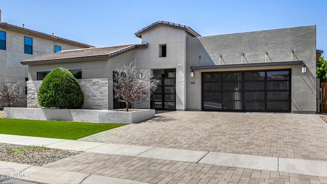 3822 E Canyon Pl, Chandler, AZ 85249 - contemporary home with decorative driveway, an attached garage, stucco siding, and a front yard